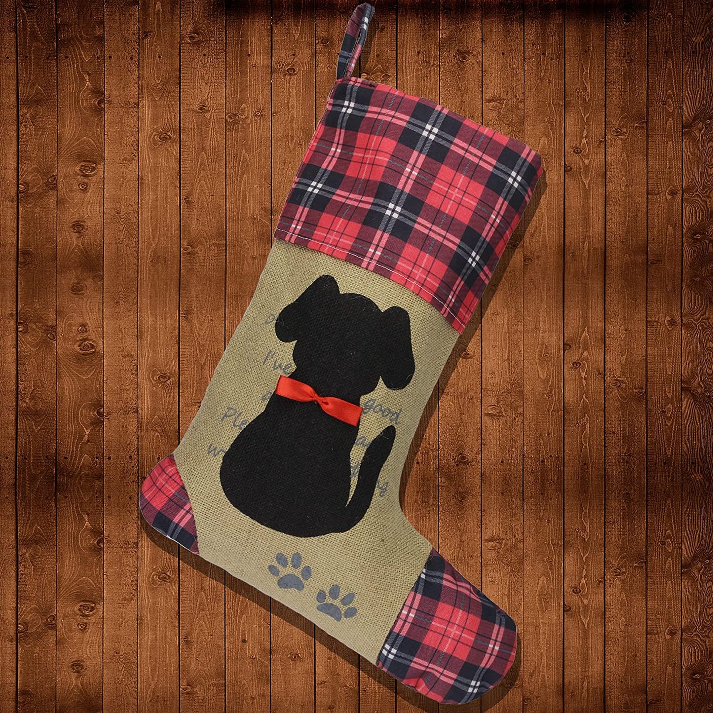 "Personalized Dog Christmas Stocking - Black with Puppy Pattern & Red Bow, Perfect Holiday Decor for Your Pup!"